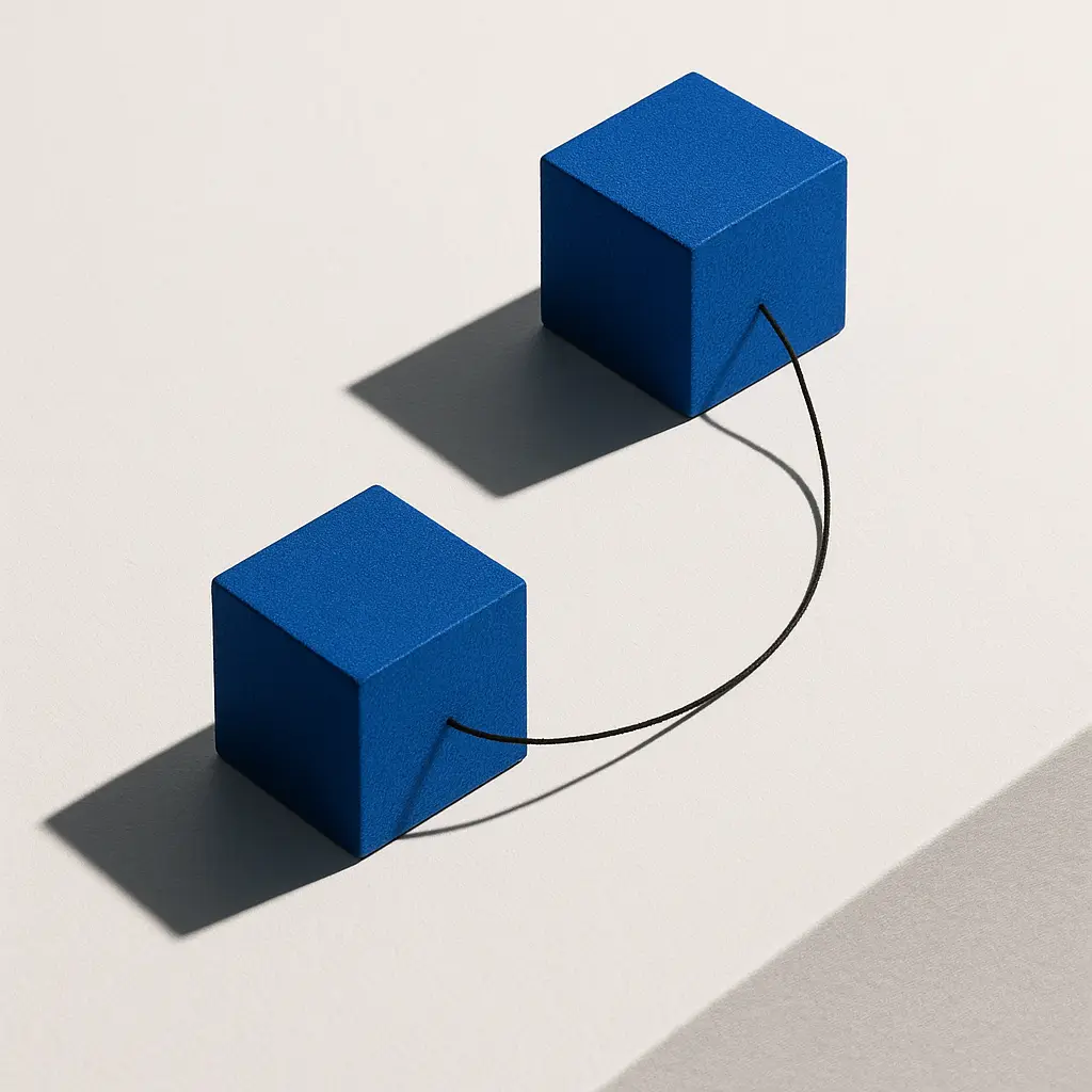 Two cobalt cubes connected by a black thread